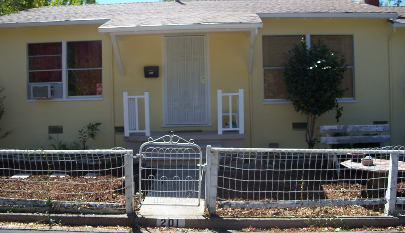 Front of The Duplex with new bark
