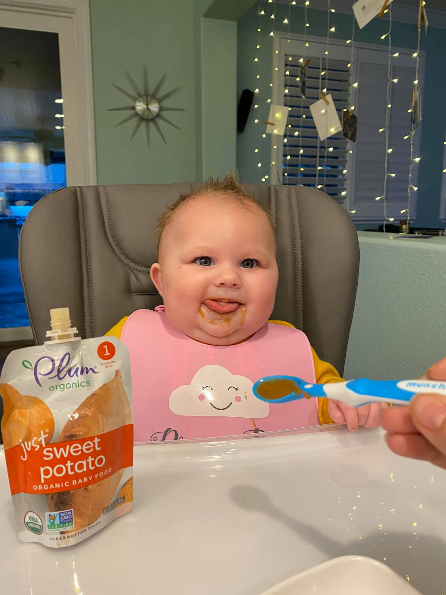 baby eating sweet potato
