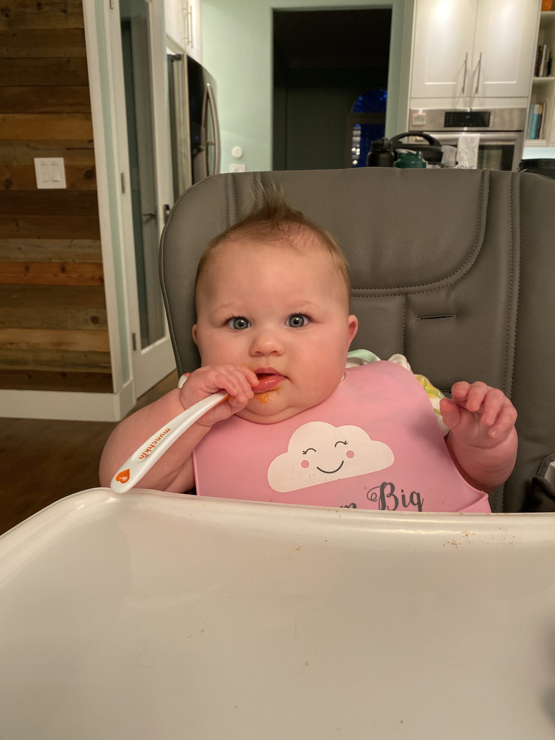 Lily in her high chair waiting for dinner