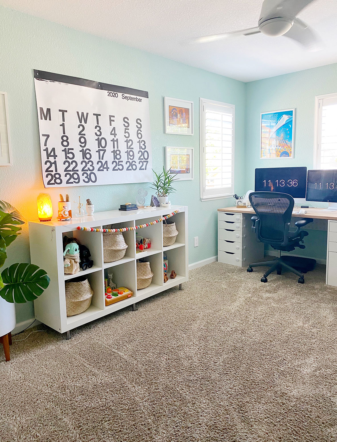 office room with bookshelf and wall calendar