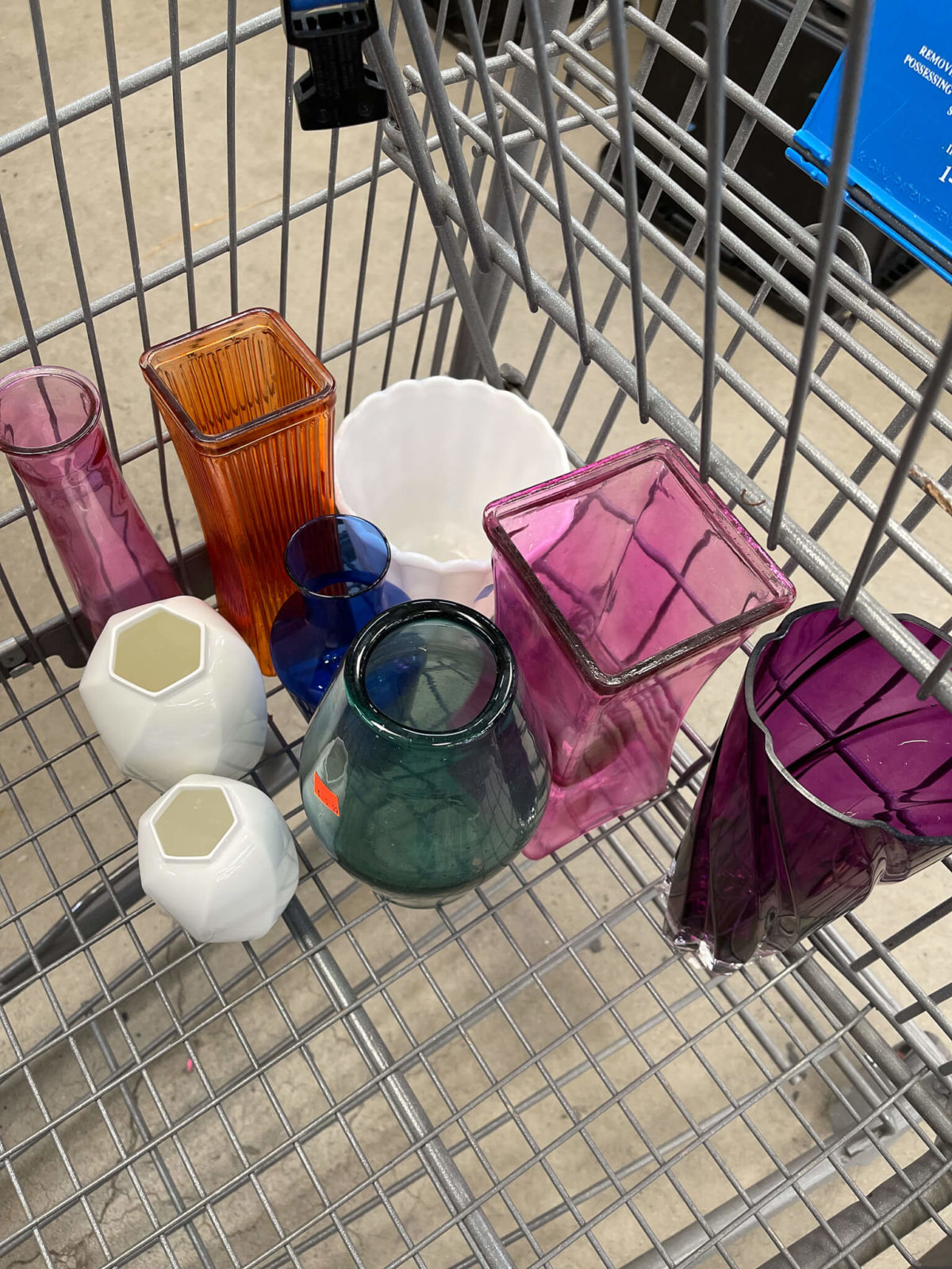 shopping cart with colored vases